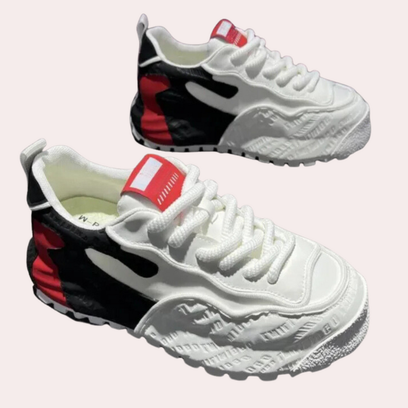 Weiße Sneaker mit rotem und schwarzem Design, sportlich, modisch, Unisex, rutschfeste Sohle.