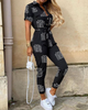 Trendiger Retro-Jumpsuit mit Knopfleiste – Velia