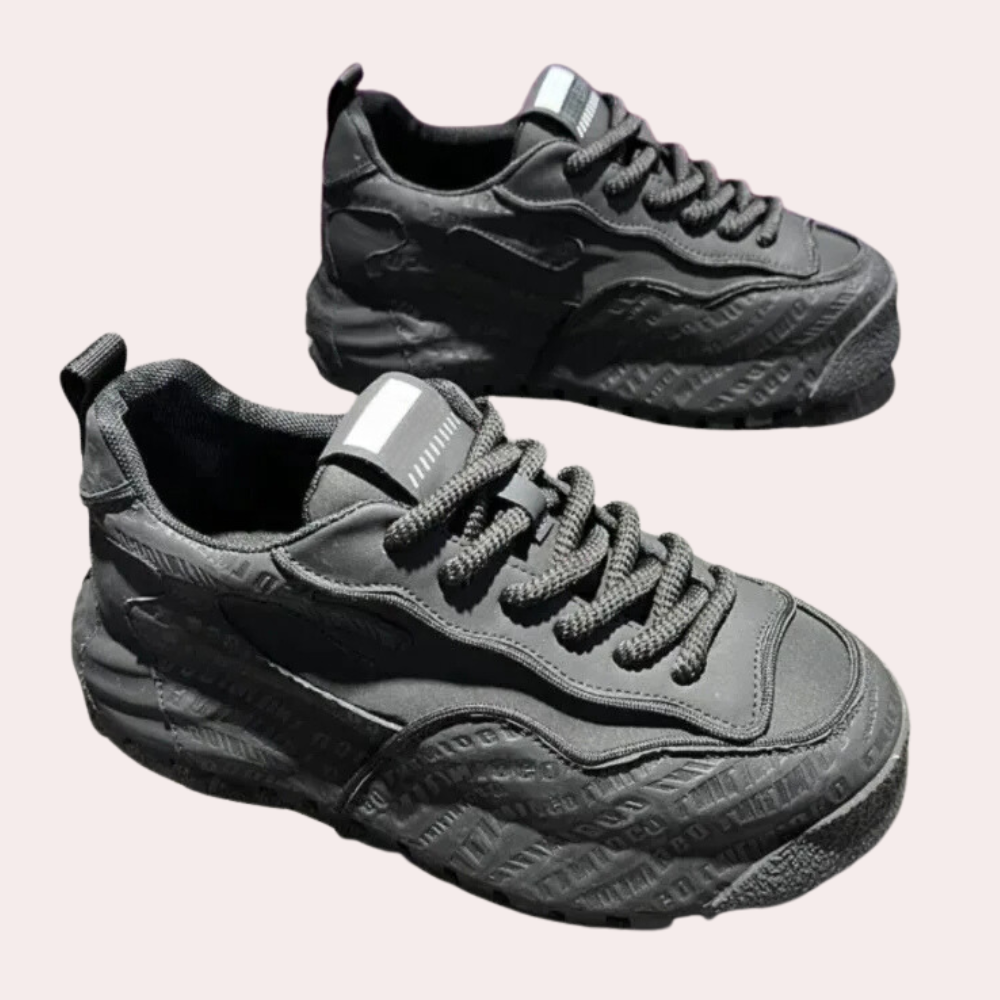 Graue Sneaker aus Leder mit geprägtem Logo, sportlich, modisch, für Herren und Damen.