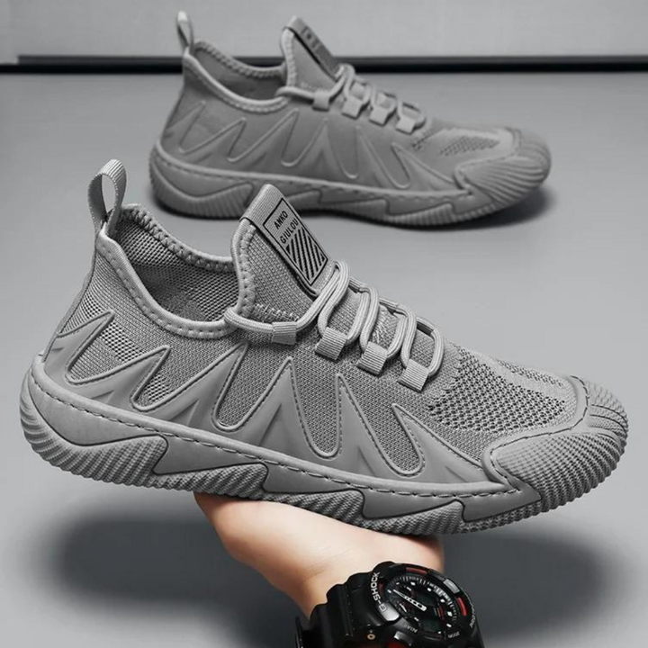 Grauer Sneaker für Herren, atmungsaktiv, rutschfest, sportlich, modisch, bequem.