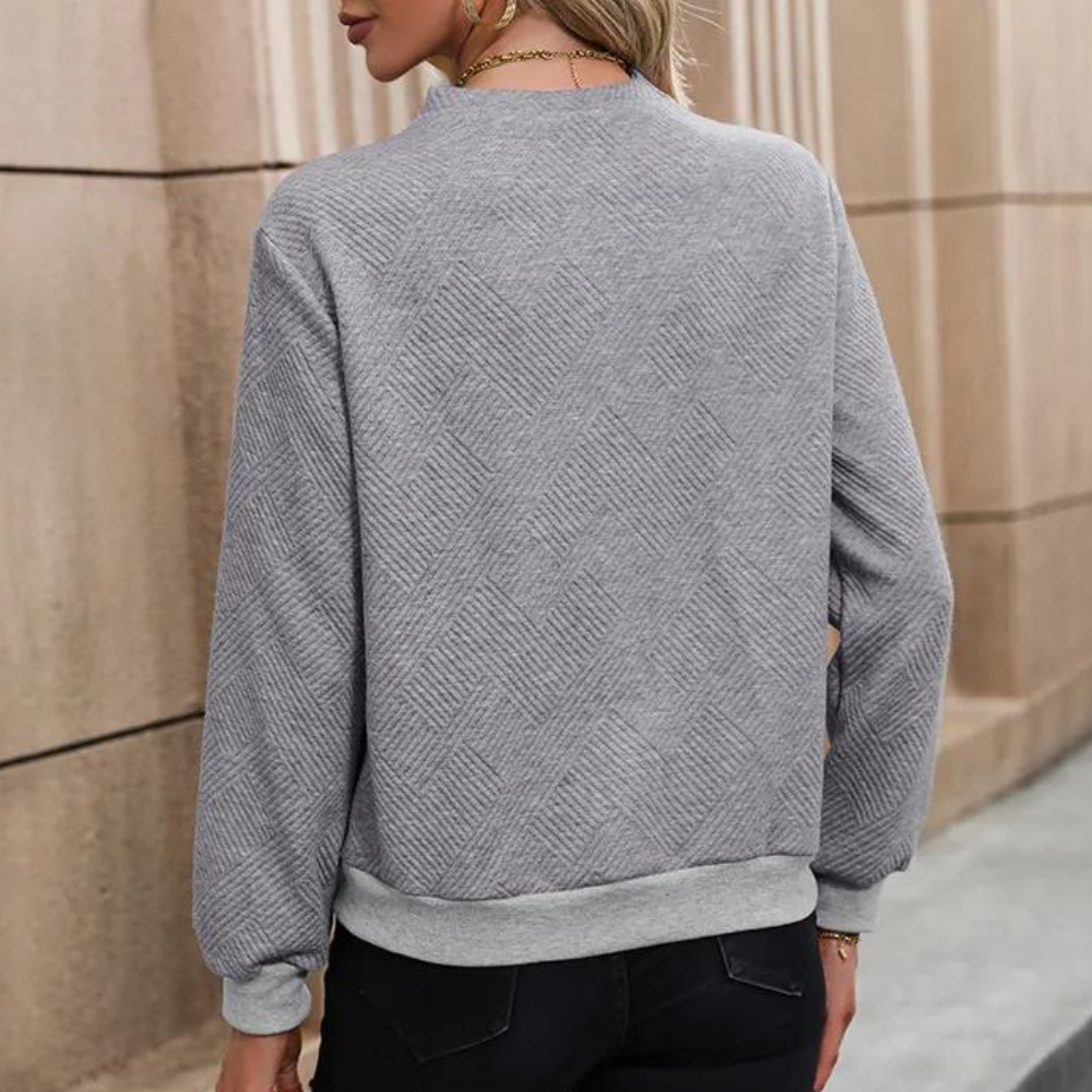 Grauer Damenpullover mit geometrischem Muster, lässig, bequem, modisch, Herbstkleidung.