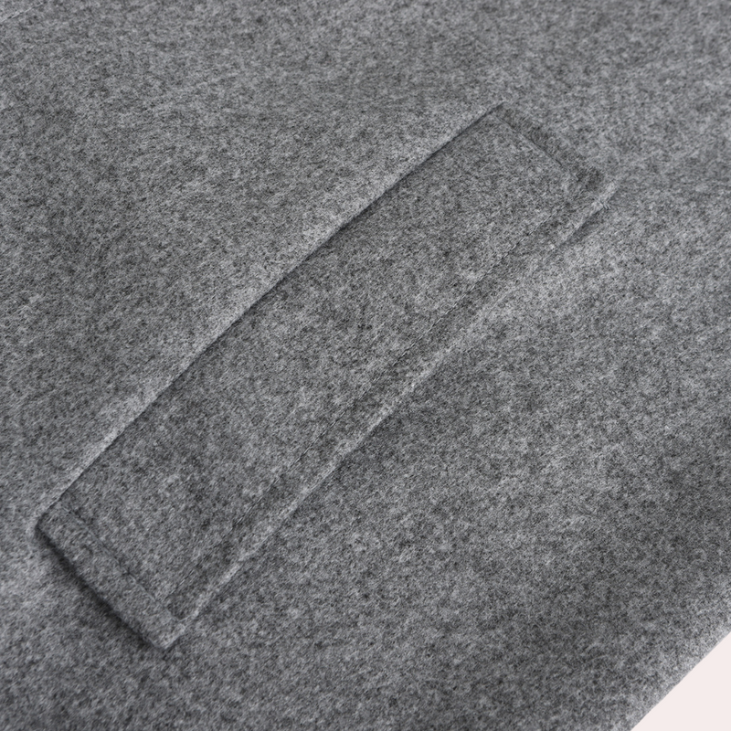 Grauer Wollstoff mit rechteckiger Naht, Detailansicht, hochwertige Textur, Mode, Bekleidung.