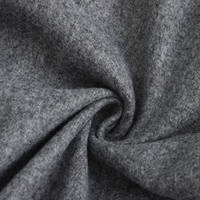Grauer Wollstoff, weiche Textur, hochwertiges Material, ideal für Bekleidung und Heimtextilien.