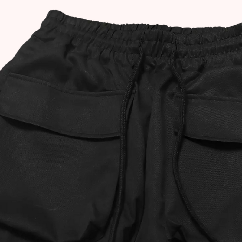 Schwarze Jogginghose mit elastischem Bund und Taschen, Sportbekleidung, Unisex, bequem.